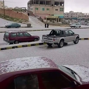 بالصور: ثلوج نيسان في العاصمة عمان