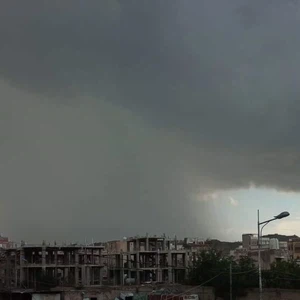 What is the name of the huge, dark cloud that brings heavy rain and thunderstorms?