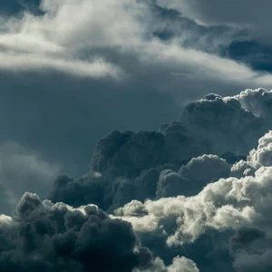 What is the term for the release of heat energy when water vapor condenses to form clouds?