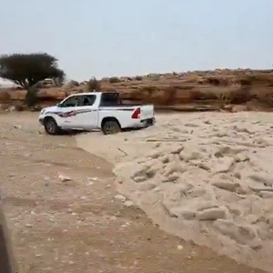 A torrential downpour of hail cuts through the desert in central Saudi Arabia