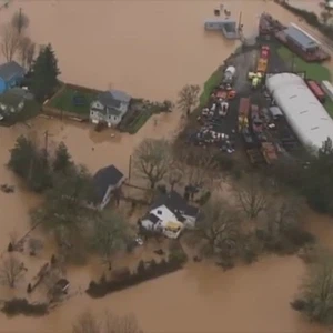 Scenes of homes and main roads submerged in massive floods that swept the US state of Washington