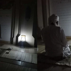 Pictures | Because of the power outages in most areas of the Sultanate of Oman, His Eminence the Sheikh prays Isha in the dark of the night