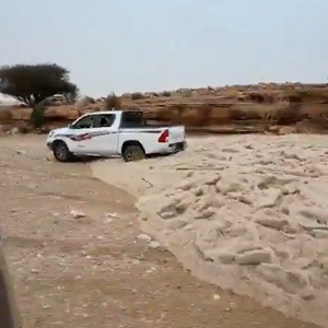 A torrential downpour of hail cuts through the desert in central Saudi Arabia
