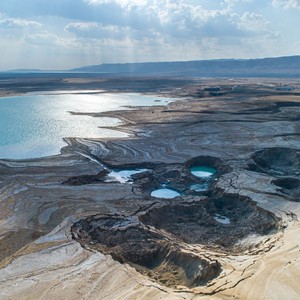 What caused the formation of dangerous sinkholes around the Dead Sea, and how dangerous are they?!