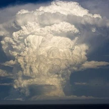 What is the characteristic feature of cumulonimbus clouds?